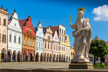 Main square of Telc city, a UNESCO World Heritage Site, on a sunny day with blue sky and clouds, South Moravia, Czech Republic.