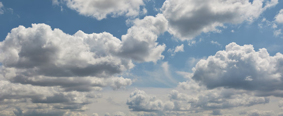 Blue skies fluffy white clouds