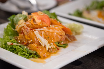 Spicy salmon salad Thai food style.