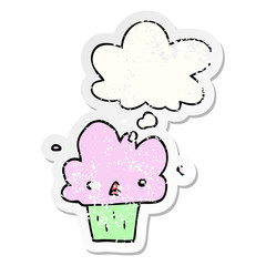 cartoon cupcake and thought bubble as a distressed worn sticker
