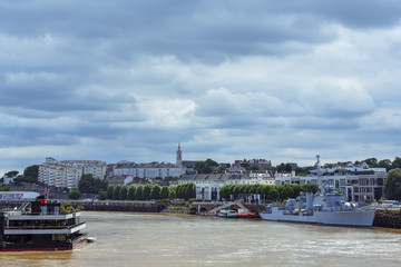 Riverside view of Nantes old buildings and shpis. Nantes, France