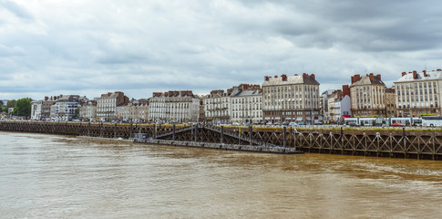 Fototapeta premium Riverside view of Nantes old buildings and shpis. Nantes, Franc