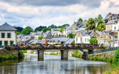 Fototapeta na wymiar River, bridge and colourful ancient houses. Josselin, beautiful village of French Brittany
