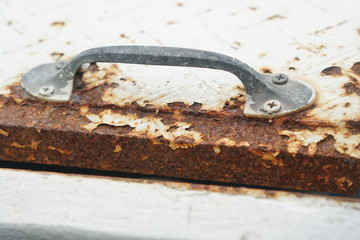 old rusty key on white background