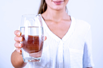 Young woman drinking glass of water