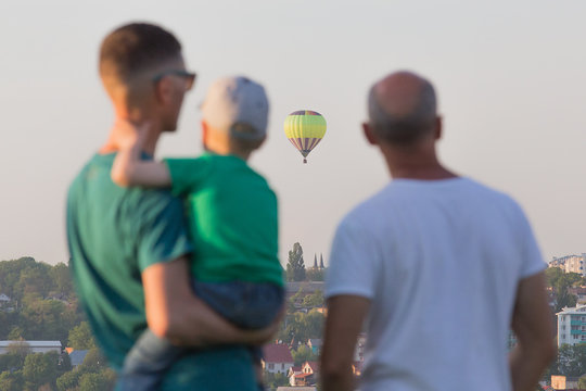 People Watching The Hot Air Balloons