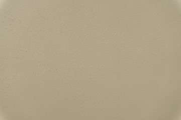 Beige or soft yellow painted concrete cement texture wall abstract background,selective focus