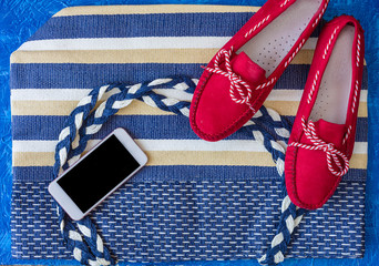 Flat lay of summer accessories, smartphone and camera. Summer outfit concept.