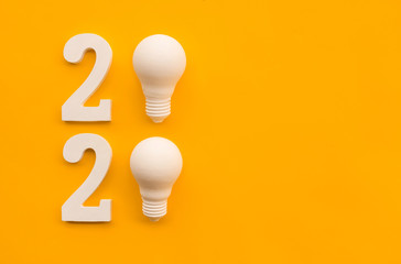 2020 creativity inspiration concepts with text nuber and lightbulb on color background