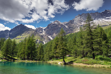 Fototapeta na wymiar Blue lakake in Alps near Breuil Cervinia, Italy.