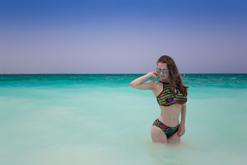 Obraz premium Woman sand beach, bikini, sunglasses, Maldives
