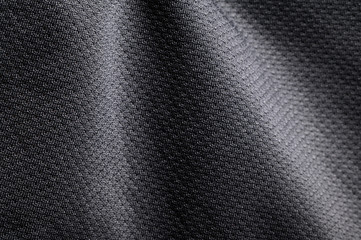 Close-up polyester fabric texture of black athletic shirt
