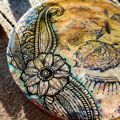 Fototapeta premium Stand cup handmade. Abstract drawing in the style of zenart. Hand painted with acrylic paints. Mobile photo.