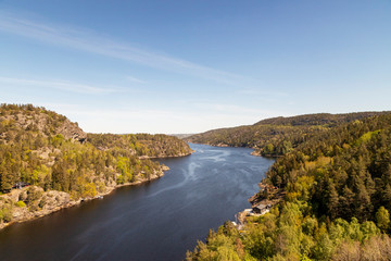 Scenic view of river amidst trees against sky