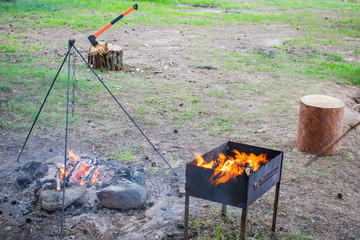 grill flares up for cooking barbecue in nature