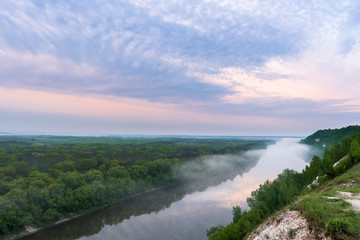 dawn on river. fog on the river. pink dawn sky