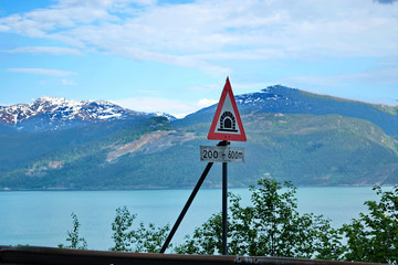 Salmon farm in a fjord between   mountains in Western Norway Hardanger fjord area at summer.