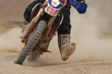 Motocross racer accelerating speed in track,driving in the motocross race