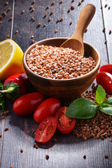 Bowl of buckwheat kasha on wooden table