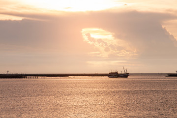 fishing boat in the sea at evening time.