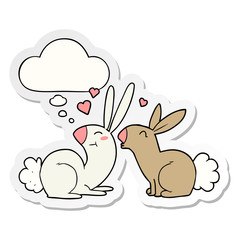 cartoon rabbits in love and thought bubble as a printed sticker