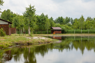 Fototapeta na wymiar Holiday house near the lake. The concept of fishing and recreation