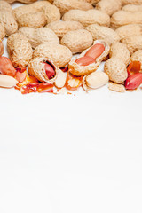 Large peeled peanuts close-up of beans in the shell. Unpeeled peanuts in the shell. Peanuts, for background or texture. Growing organic protein