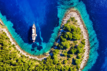 Croatia. Yachts at the sea surface. Aerial view of luxury floating boat on blue Adriatic sea at...