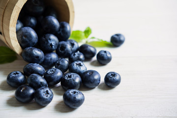 Fresh blueberries on white wooden table