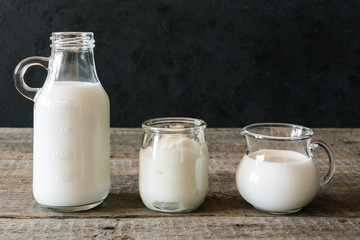 Dairy cuisine. Fresh milk and healthy yogurt on wooden table.