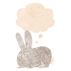 cartoon rabbit and thought bubble in retro textured style