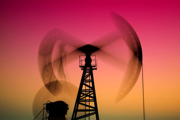 Crank balanced beam pumping unit in Jidong oilfield sunset scenery, closeup of photo