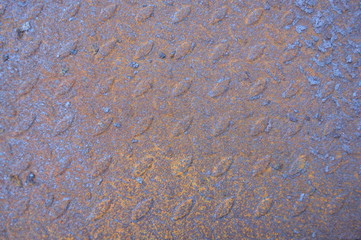 Natural relief metal texture with rust and scuffs. The lower part of the barbecue top view