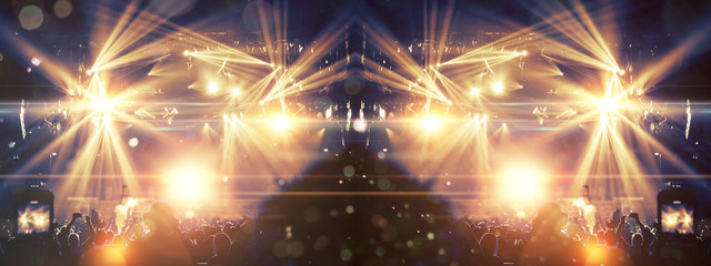 Concert hall with people filming with smart phones