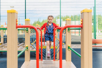 Fototapeta premium Active little girl on playground
