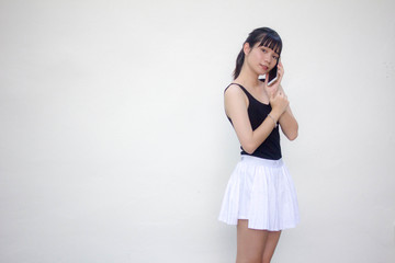 Portrait of thai adult beautiful girl black shirt white skirt calling smart phone