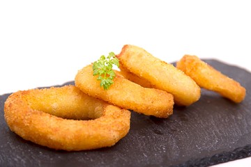 fried onion rings on slate
