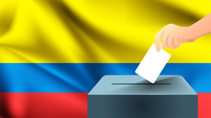 Male hand puts down a white sheet of paper with a mark as a symbol of a ballot paper against the background of the Colombia flag, Colombia the symbol of elections