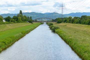 Peaceful canal or river in green countryside