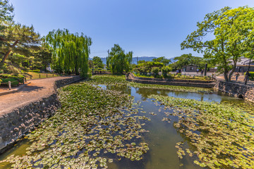 Fototapeta na wymiar Matsumoto - May 25, 2019: The gardens around the castle of Matsumoto, Japan