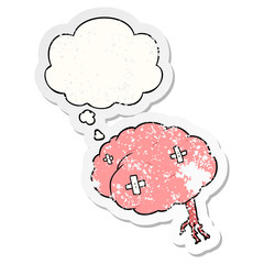 cartoon injured brain and thought bubble as a distressed worn sticker
