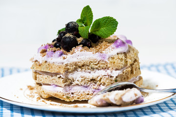 tasty cake with blueberries and cream, closeup