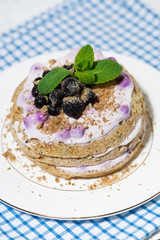 tasty cake with blueberries and cream, vertical top view