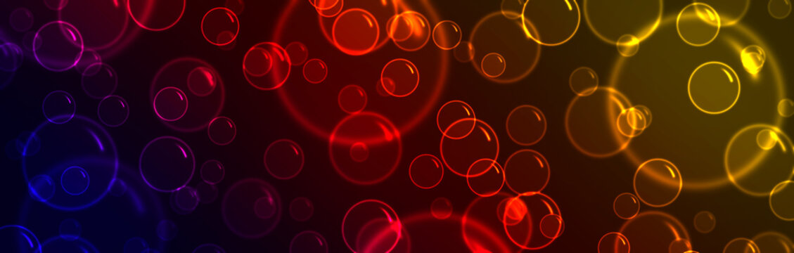 Glowing colorful bubbles on a dark background