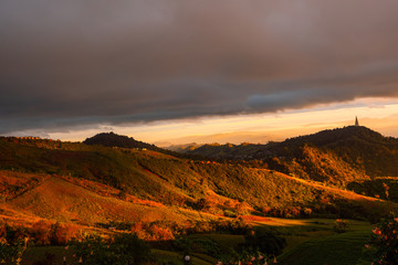 The sun's rays penetrate the clouds in the mountains.