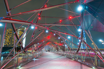 Helix bridge at night in Singapore.