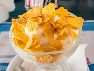 energetic Mediterranean breakfast with Greek yogurt and corn flakes with honey