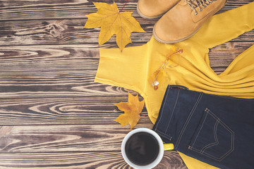 Fototapeta na wymiar Top view shot of autumn background. Fall woman`s clothes flat lay picture. Woman wardrobe.