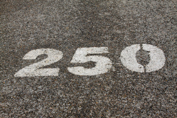 Numbers on the asphalt road
