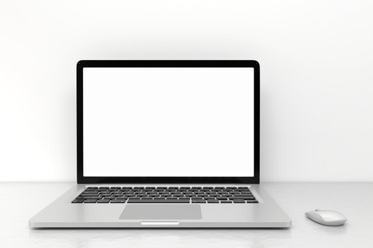 Laptop computer with blank white screen and mouse on the white table. screen mockup template
